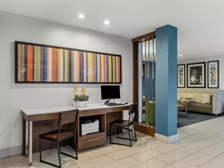 Business center with computers and workspace