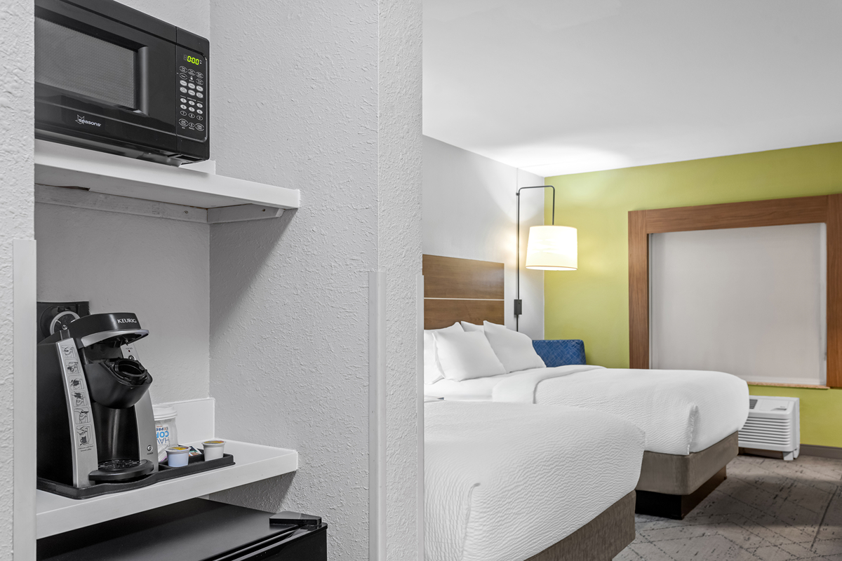Modern guest room with two double beds
