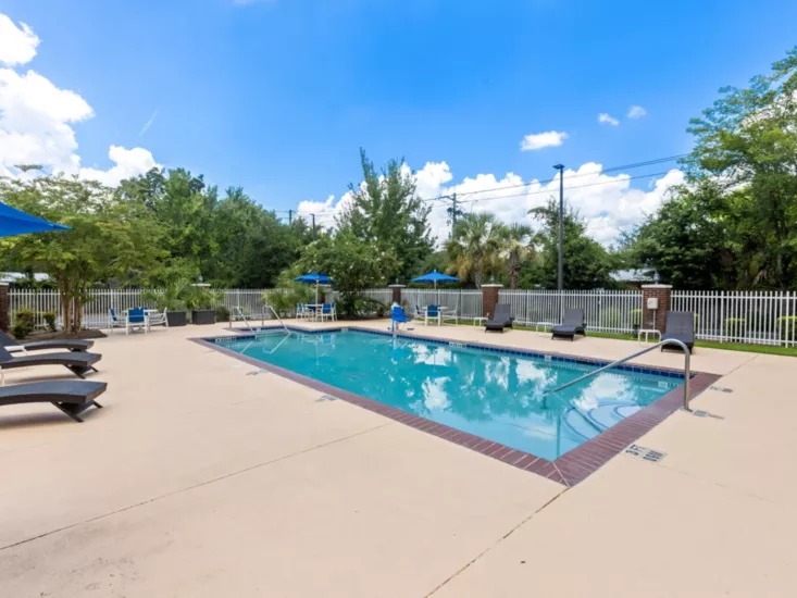 Outdoor swimming pool with lounge chairs